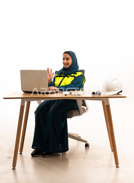 Saudi Female Engineer with Laptop and Safety Gear
