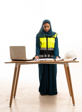 Arab Female Engineer with Blueprints and Hard Hat Arab Female Engineer with Blueprints and Hard Hat