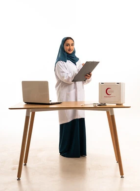 Saudi Female Doctor in White Coat with Medical Equipment
