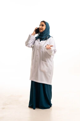 Saudi Female Doctor on Phone in White Lab Coat