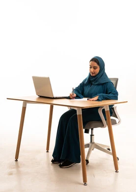 Saudi Woman in Abaya Working at Office Desk