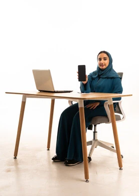 Emirati Businesswoman with Laptop and Smartphone