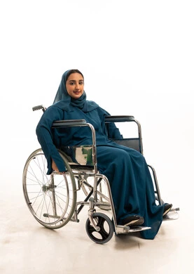 Saudi Woman in Wheelchair Wearing Abaya Studio Portrait