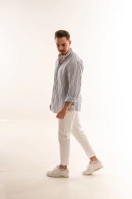 Saudi Man in Casual Wear Walking in White Studio