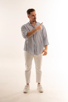 Saudi Man Pointing at Copy Space on White Background