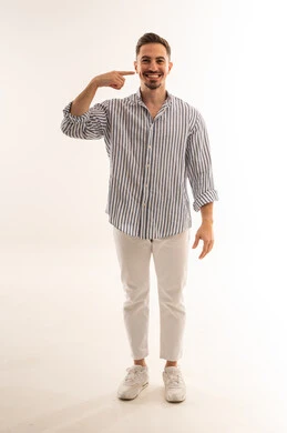 Saudi Man Pointing at Cheek on White Background