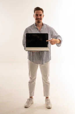 Saudi Man Holding Laptop with Blank Screen White Background