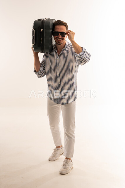 Saudi Man with Suitcase and Sunglasses on White