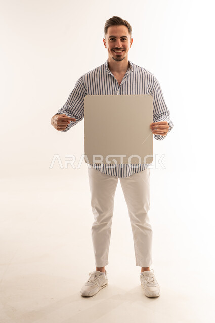 Saudi Man Holding Blank Signboard on White Background