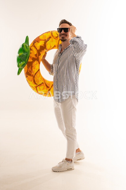 Saudi Man in Summer Outfit with Pineapple Float