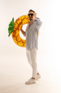 Saudi Man in Summer Outfit with Pineapple Float