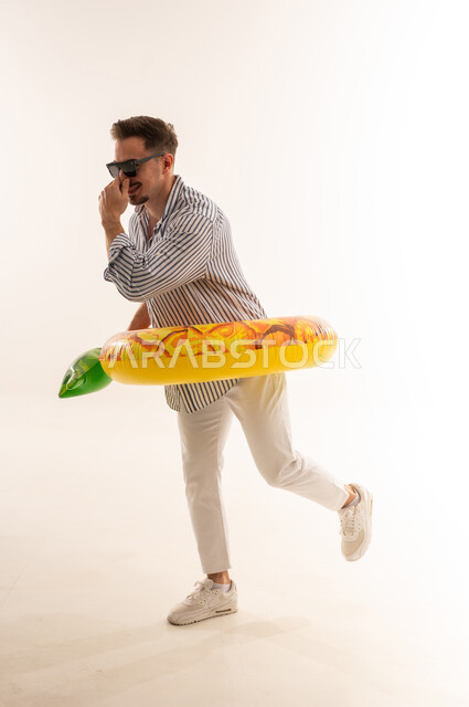Saudi Man with Swimming Ring in White Studio