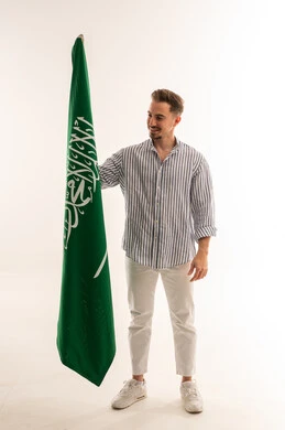 Saudi Man Holding National Saudi Arabia Flag Studio Shot