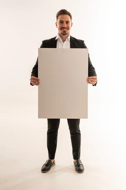 Saudi Businessman Holding Blank Poster on White Background