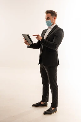 Saudi Businessman with Tablet and Medical Face Mask