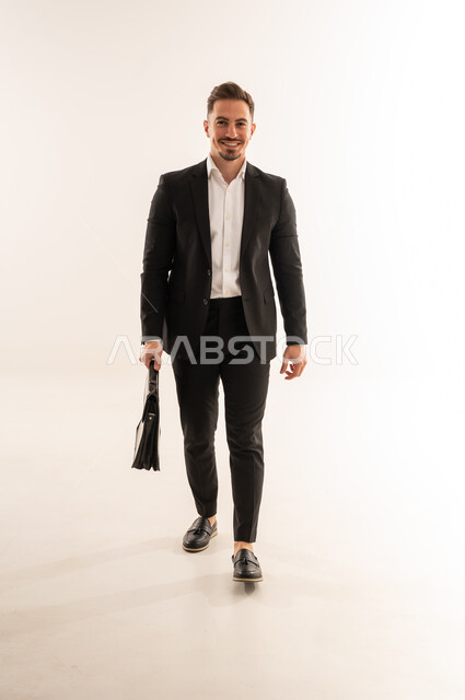 Saudi Businessman in Formal Suit Walking with Briefcase