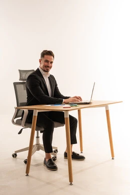 Saudi Businessman at Modern Office Desk with Laptop