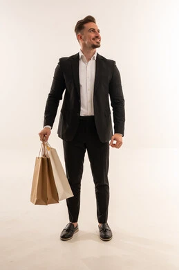 Saudi Man in Suit Holding Shopping Bags Studio