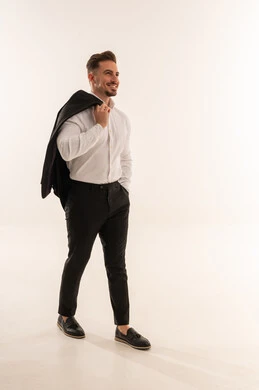 Smiling Saudi Man in Business Attire Walking in Studio