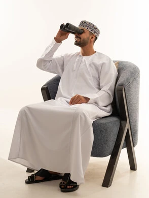 Omani Man with Binoculars in Traditional Attire