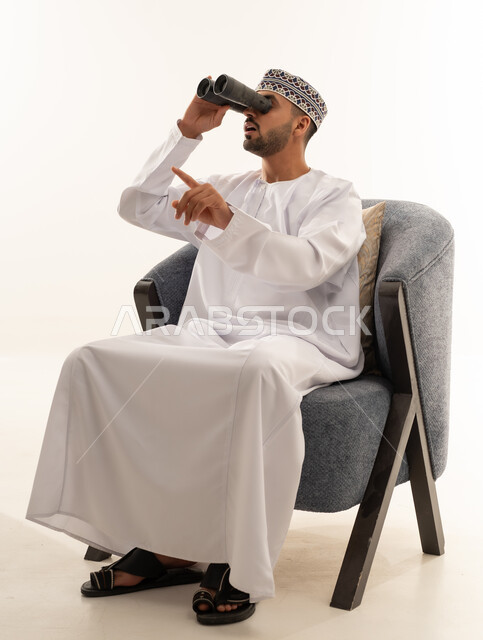 Omani Man with Binoculars in Traditional Dress