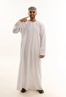 Omani Man in Traditional White Dishdasha and Kumma