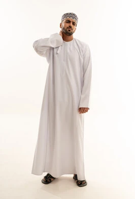 Omani Man in Traditional White Dishdasha and Kumma