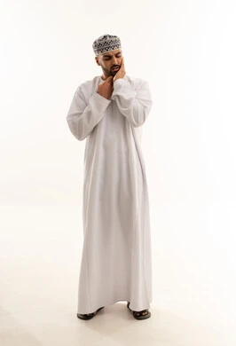 Omani Man in Traditional Dress with Toothache Pain