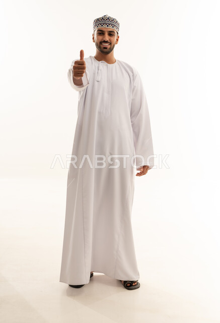 Omani Man in Traditional Dishdasha Thumbs Up