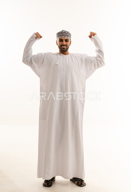 Omani Man in Traditional Dress Flexing Muscles