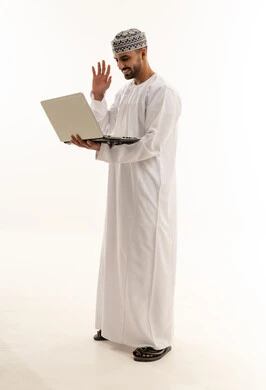 Omani Man in Traditional Dress Using Laptop for Video Call