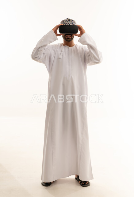 Omani Man in Traditional Dress Using VR Headset