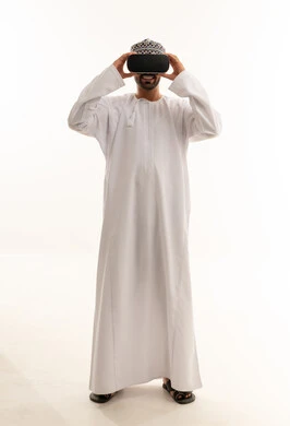 Omani Man in Traditional Dress Using VR Headset
