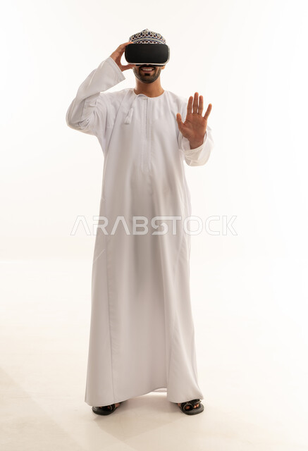 Omani Man in Traditional Dress Using VR Headset