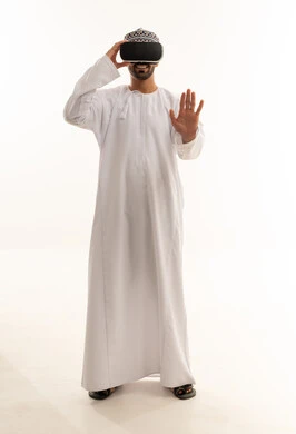 Omani Man in Traditional Dress Using VR Headset