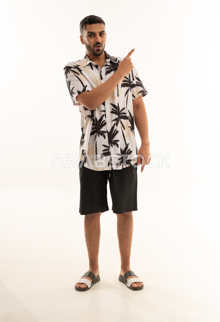 Arab Man in Summer Shirt Pointing on White Background