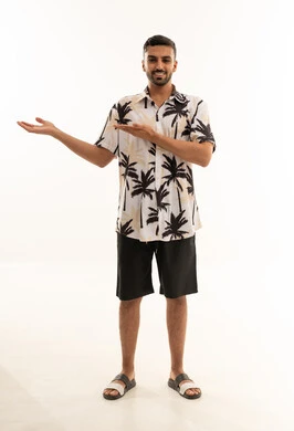 Saudi Man in Summer Shirt Pointing at White Background