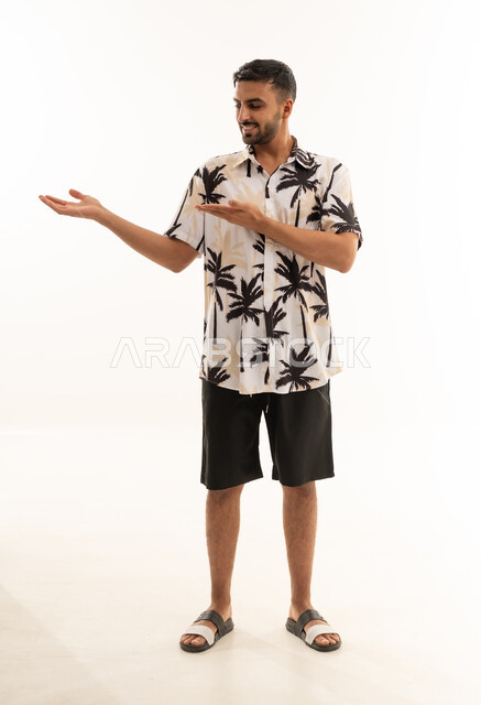 Arab Man in Summer Shirt Pointing at White Background