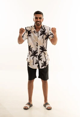 Arab Man in Summer Palm Shirt Celebrating Success