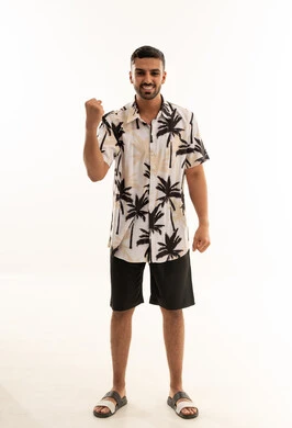 Saudi Man Victory Gesture in Summer Clothing White Background
