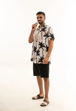 Saudi Man with Microphone in Tropical Shirt
