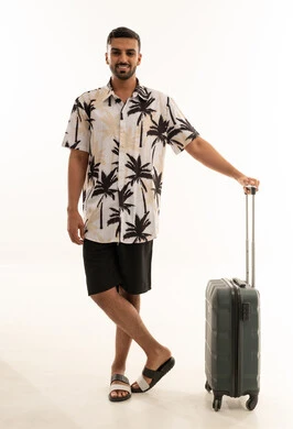 Saudi Man With Suitcase Wearing Summer Attire