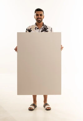 Saudi Man Holding Blank Whiteboard in Studio