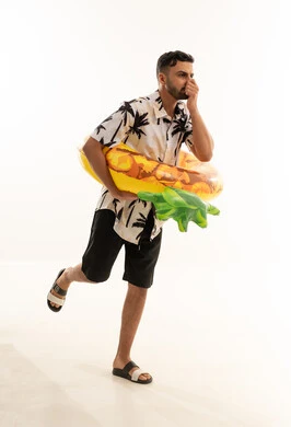 Saudi Man in Summer Clothes with Inflatable Ring