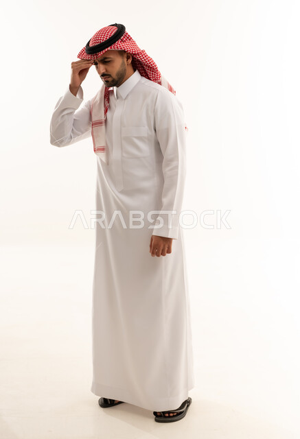 Saudi Man in Traditional Thobe Feeling Stressed