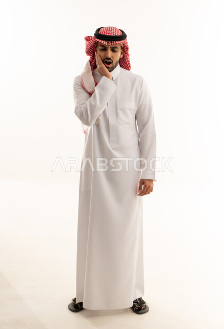 Saudi Man in Thobe with Toothache Pain