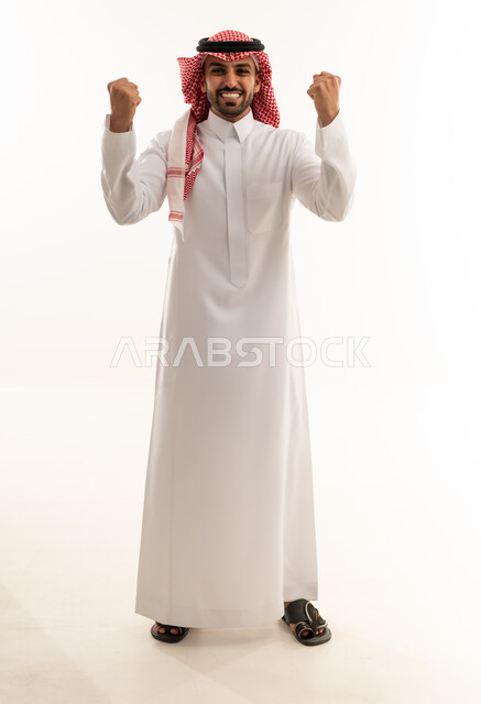 Saudi Man Celebrating Success in Traditional Attire