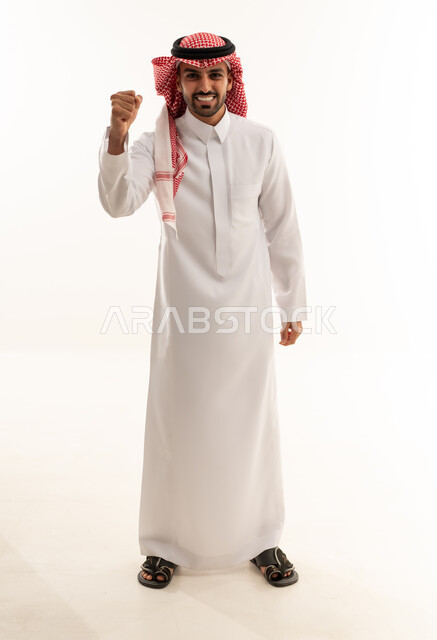 Saudi Man in Traditional Thobe Celebrating Victory