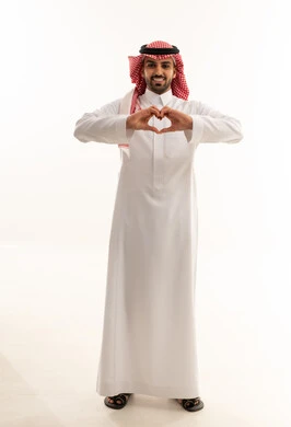 Saudi Man Making Heart Gesture on White Background