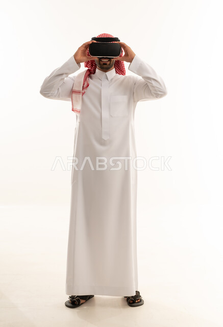 Saudi Man in Traditional Thobe Wearing VR Headset